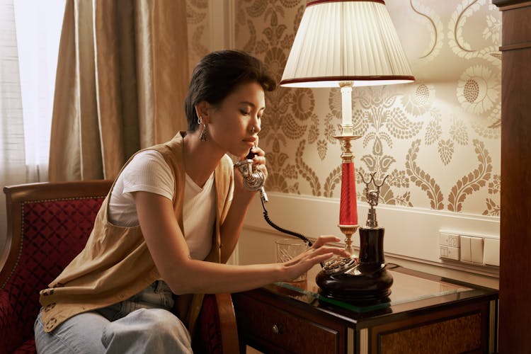 Sitting Woman Talking On Vintage Phone