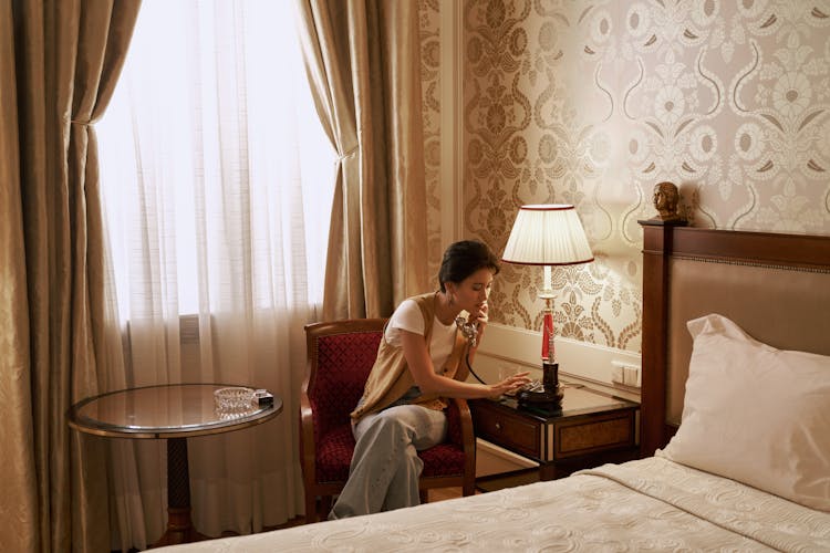 Sitting Woman Talking On Vintage Phone