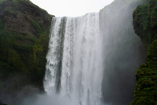 Dramatic view of the iconic Skógafoss waterfall in Iceland showcasing the power of nature.