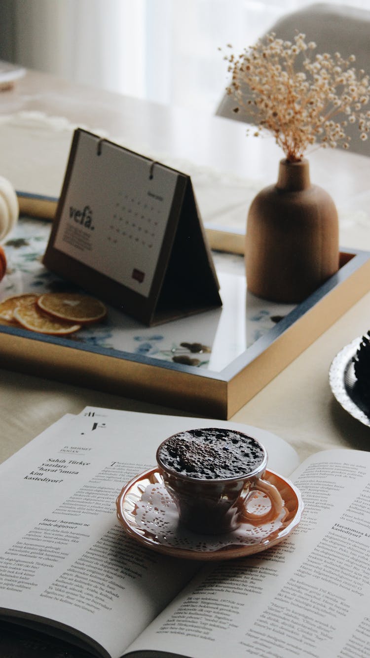 Coffee, Magazine And Calendar On Table