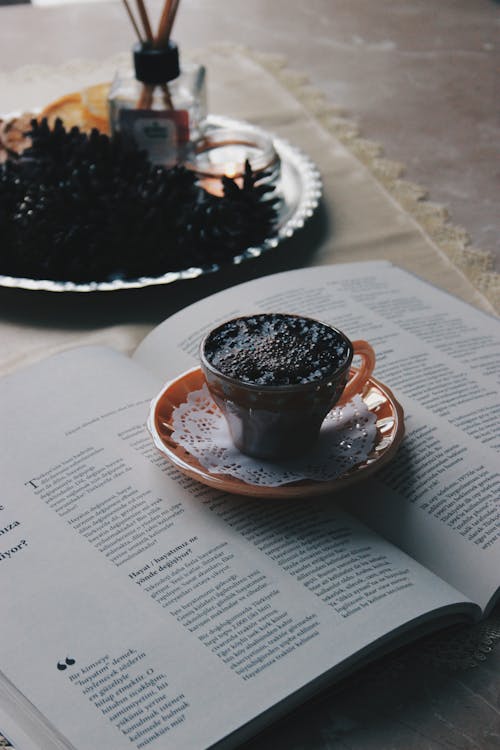 A Cup of Hot Choco Drink on an Open Book