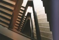 View From the Top of a Wooden Staircase wirh railings