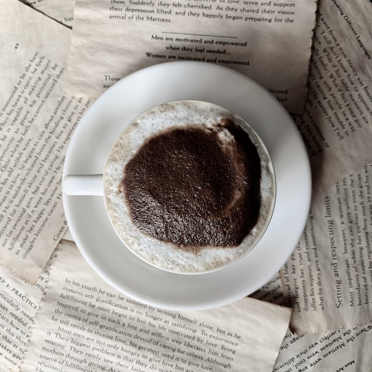 Coffee In Cup On Paper Background