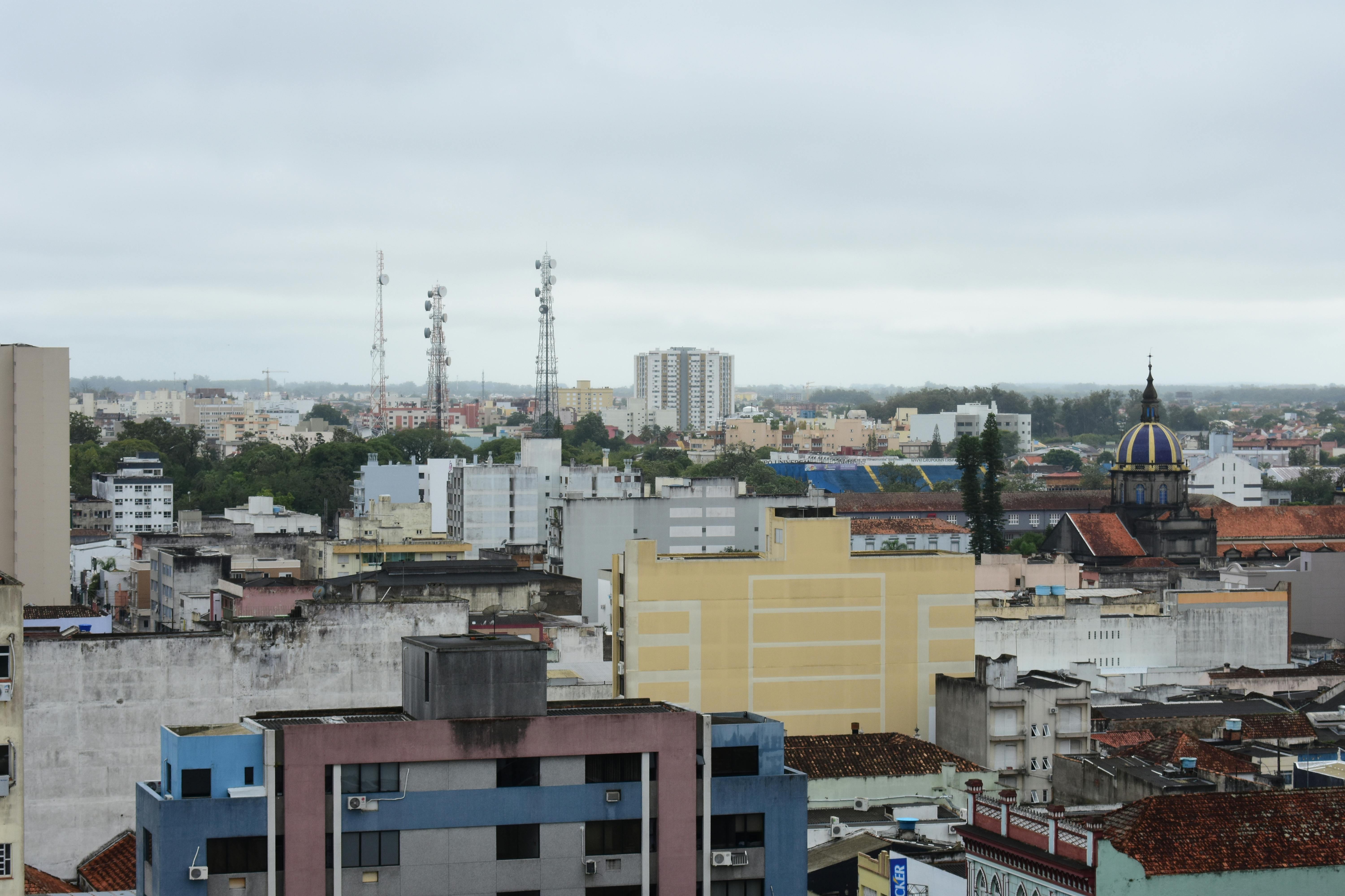 Free stock photo of apartment buildings, city, gray sky