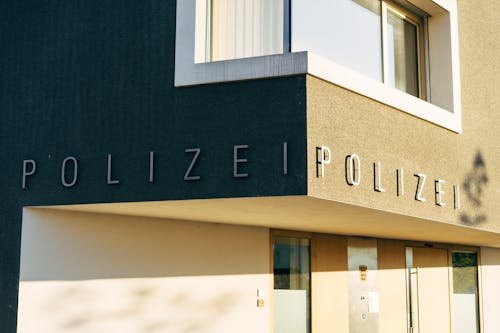 Free Facade of a Police Station with Sign Stock Photo
