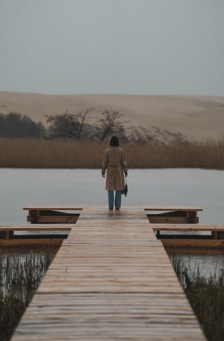 Woman Standing On Jetty