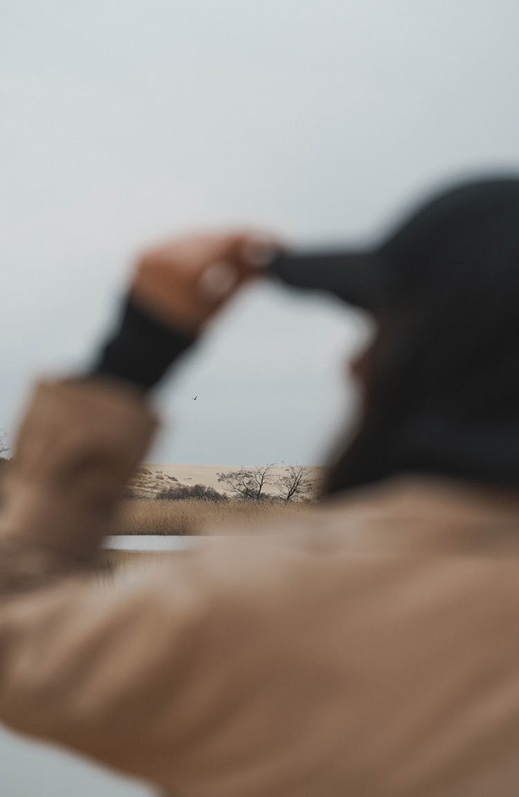 Back Of Woman In Brown Coat