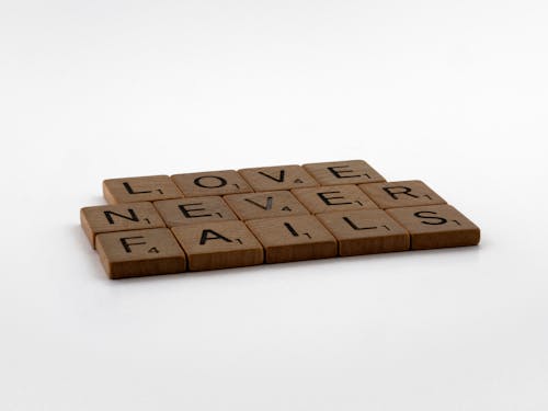 Free Wooden Scrabble Tiles on White Surface Stock Photo