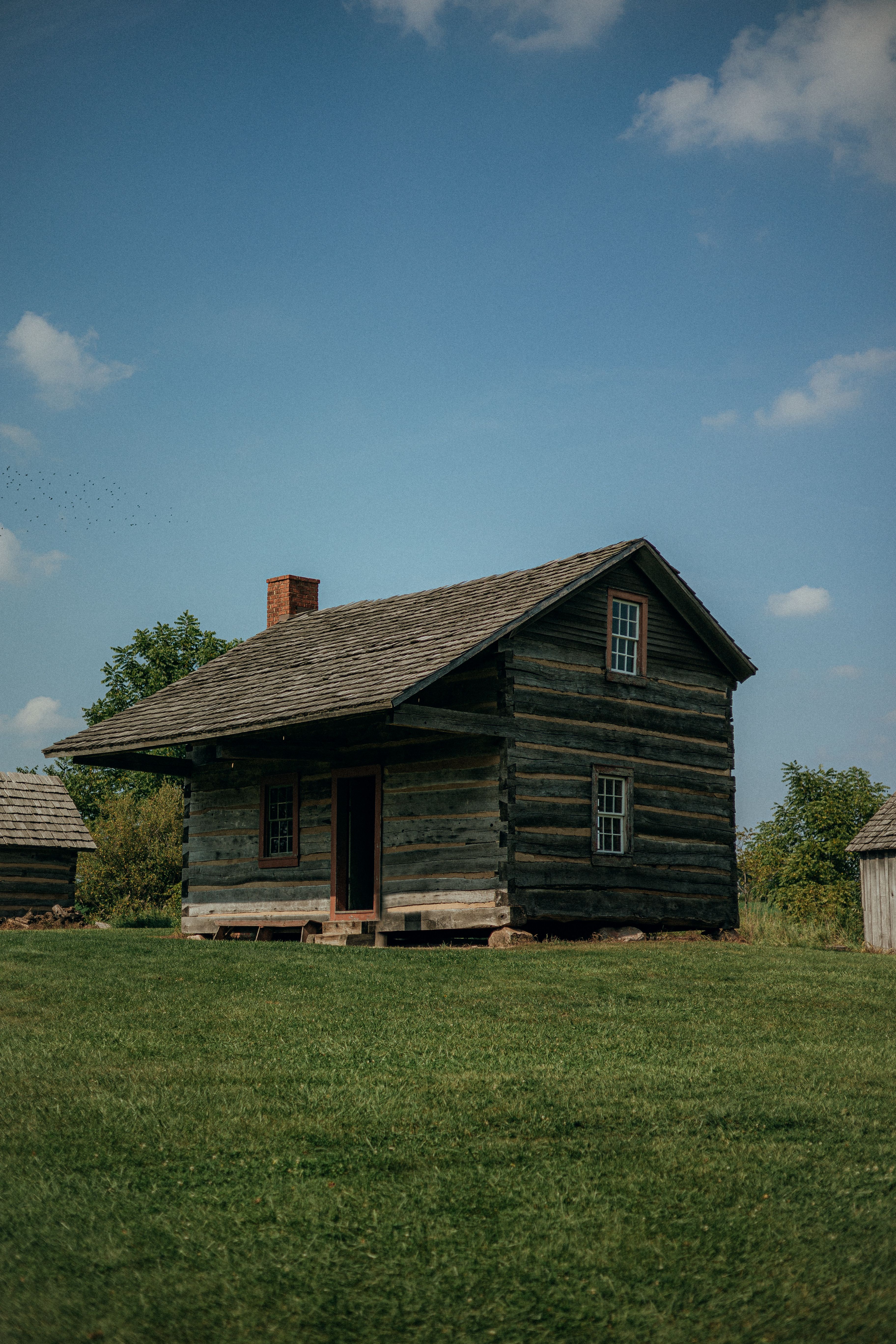A Wooden House on Grass Field · Free Stock Photo