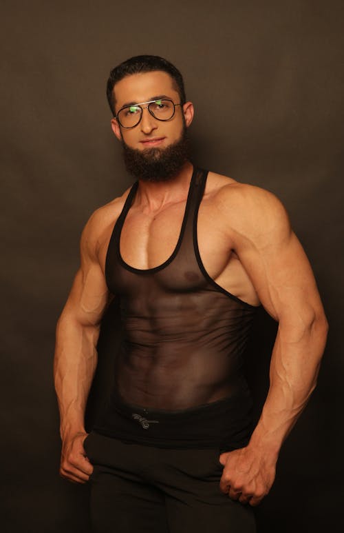 A Muscular Man wearing Eyeglasses