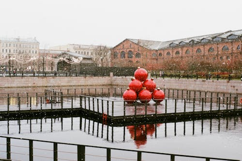 Big Red Christmas Baubles Displayed Outdoors