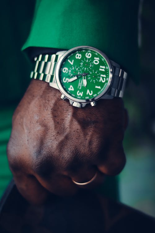 Free Person Wearing Green Face Analog Watch Stock Photo
