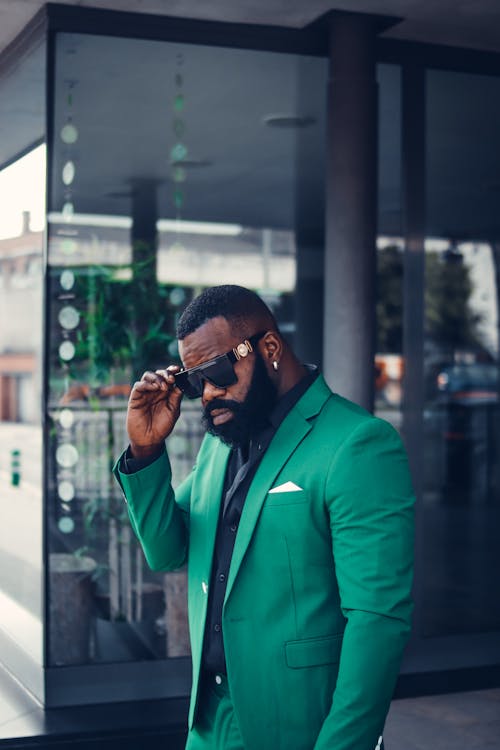 A Man in the Green Suit wearing Sunglasses