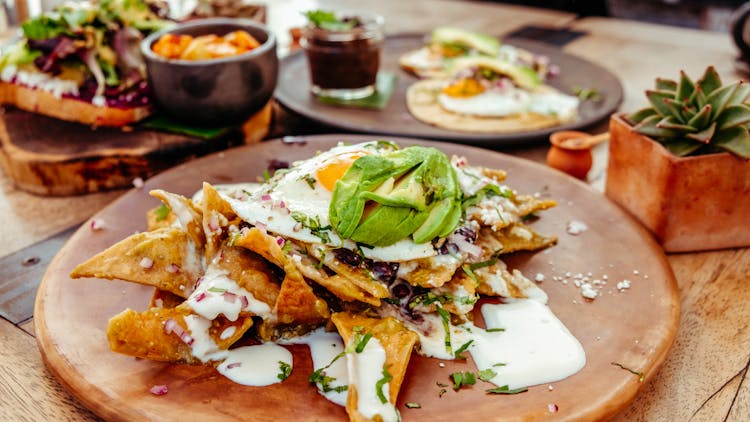 Traditional Mexican Breakfast Dish With Tortilla And Cheese