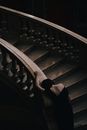 Woman in Black Dress on Staircase
