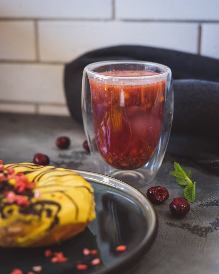 Donut And Juice In Glass