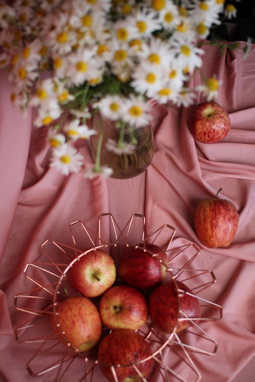 Free Bunch of Marigolds and Basket of Ruddy Apples From Above Stock Photo