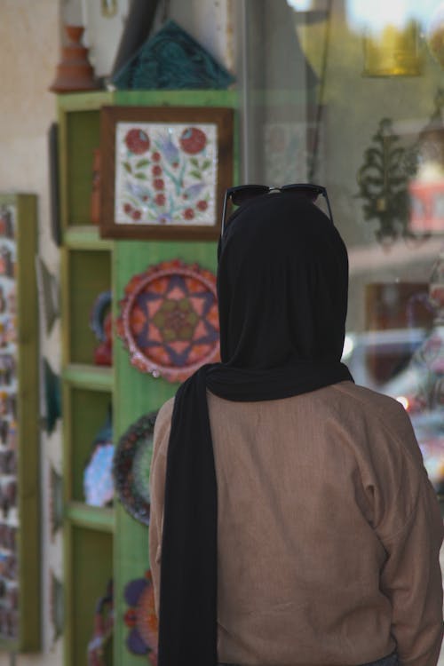 Back View Shot of a Woman Wearing Black Hijab 
