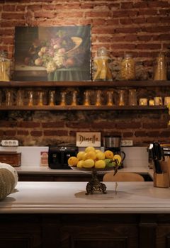 Warm, rustic kitchen scene showcasing lemons on a countertop in a cozy home setting.