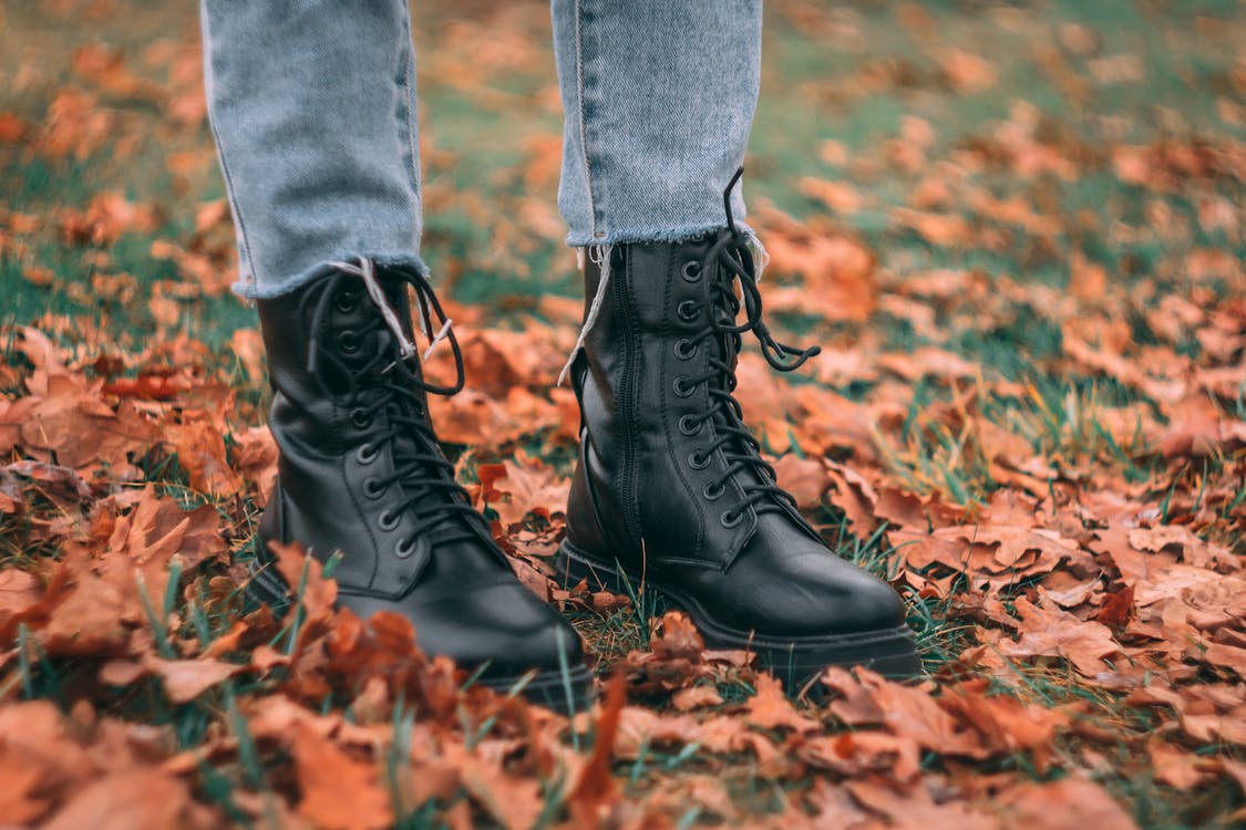 Free Photo of a Person Wearing Black Leather Boots Stock Photo