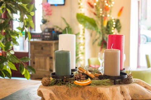 Pillar Candles on Brown Wooden Table
