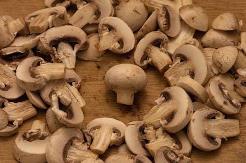 Free Sliced Mushrooms on Brown Wooden Table Stock Photo
