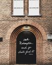 Black Wooden Door With Quote Printed at Daytime