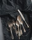 Photo of Stainless Steel Cutlery on Black Cloth