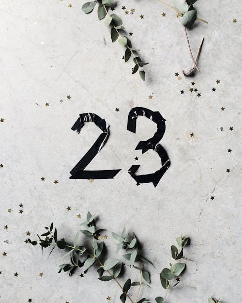 Free Number Sticker on a Concrete Surface Stock Photo
