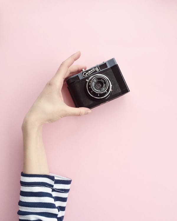 Free Person Holding Black Point And Shoot Camera Stock Photo