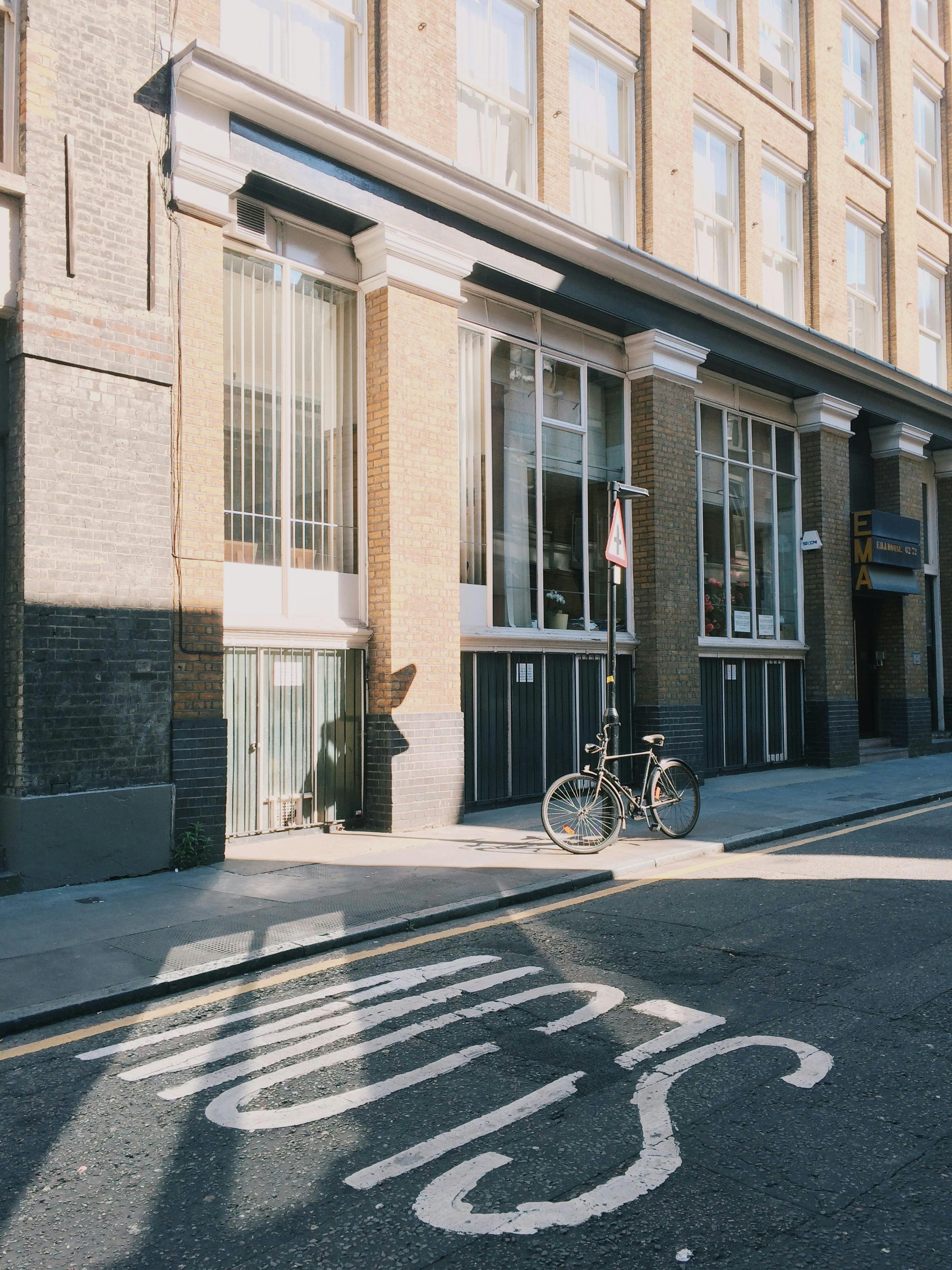 Black City Bicycle in Front of Building