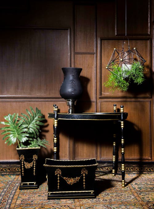 Black Wooden End Table Near Square Brown and Black Wooden Pot and Rectangular Black and Brown Wooden Trunk