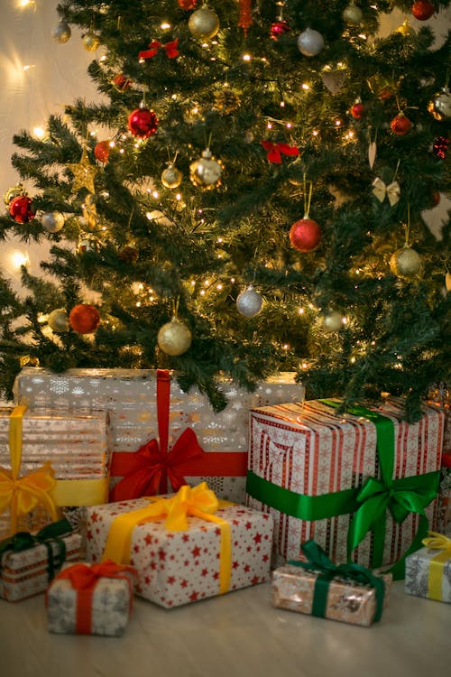 Photo of Christmas Gifts Under a Christmas Tree
