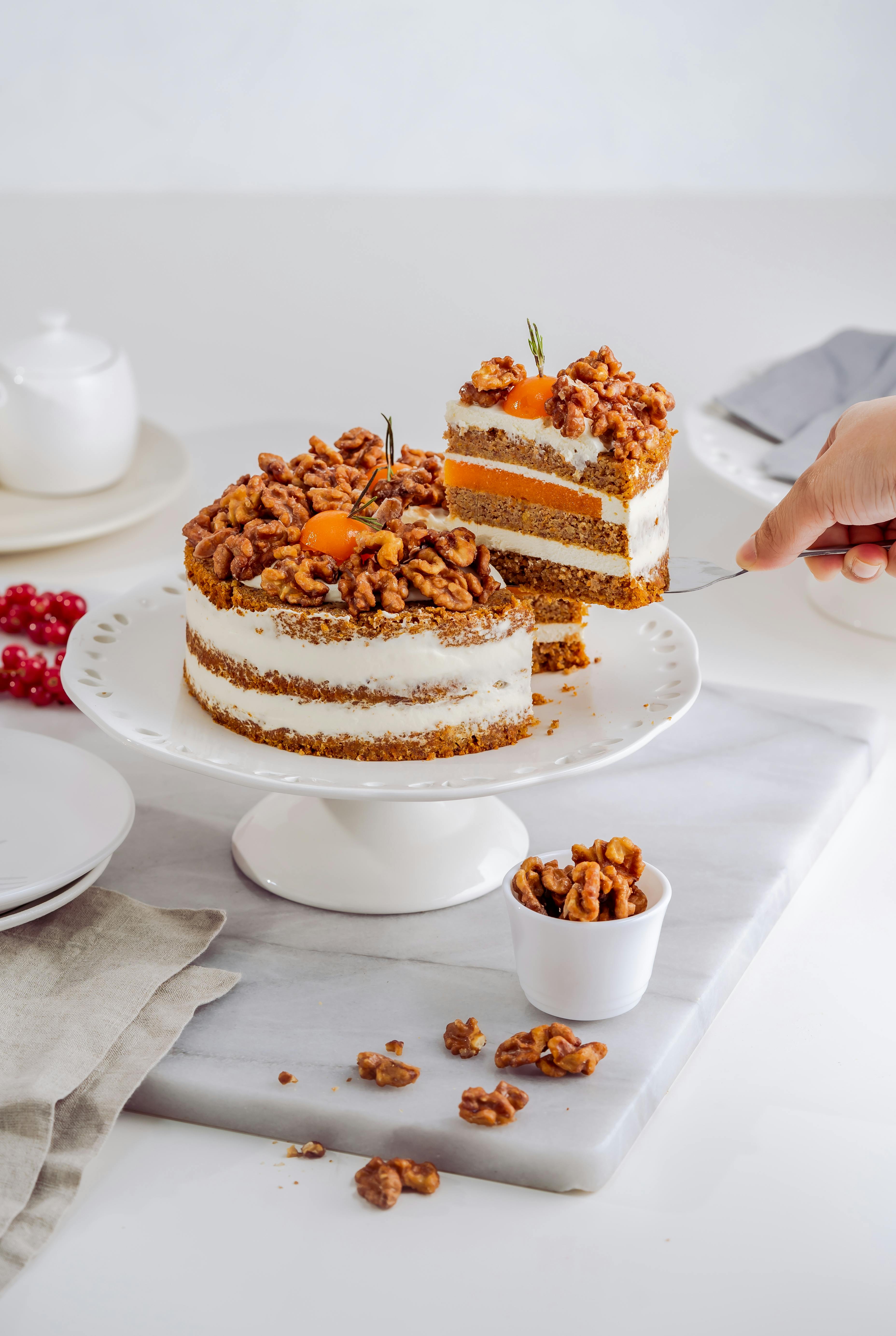cake with walnuts on cake stand
