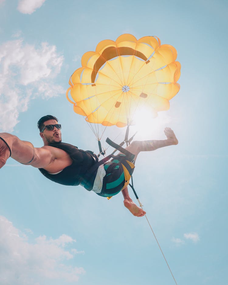 Fit Young Man Parasailing And Making Selfie