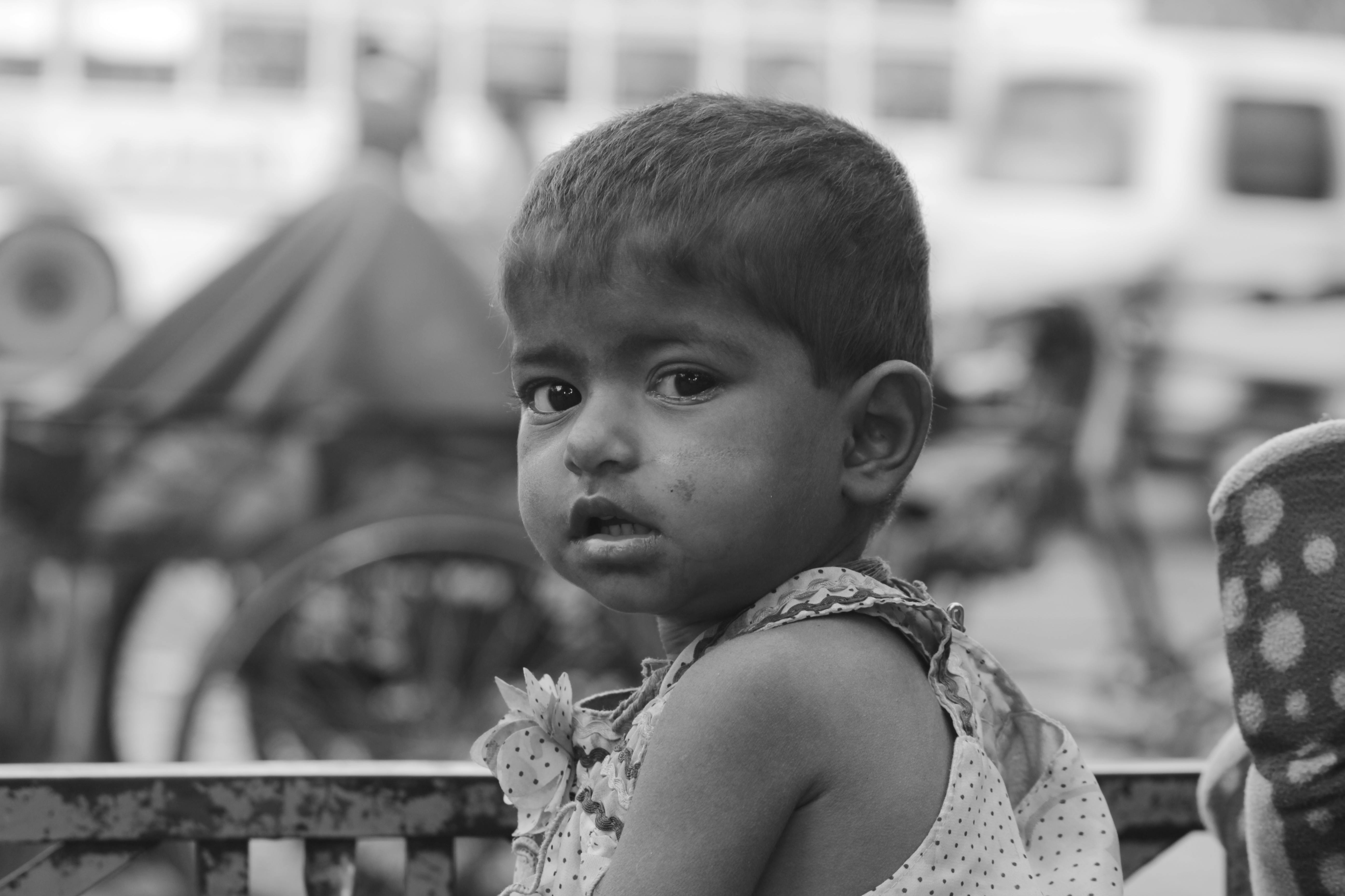 Two hands reaching for each other, with a blurred background of stars, symbolizing cosmic connection and zodiac compatibility.
