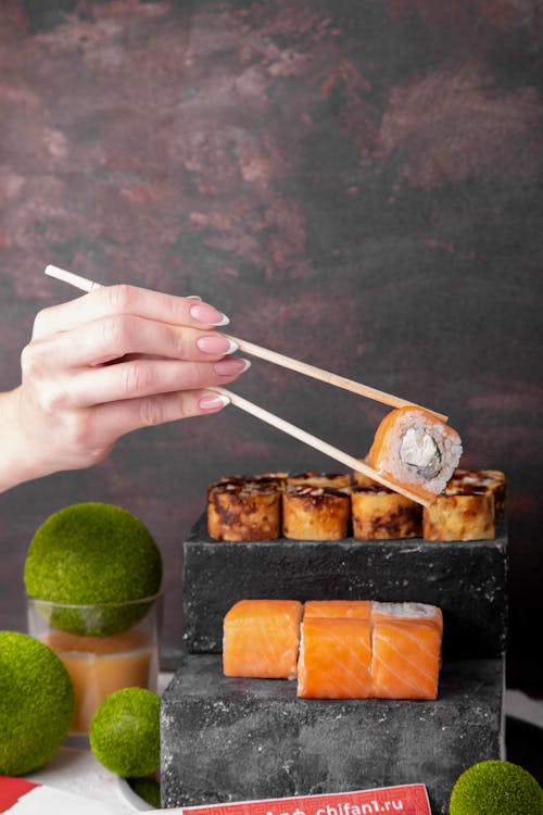 A Person Using a Chopsticks in Eating