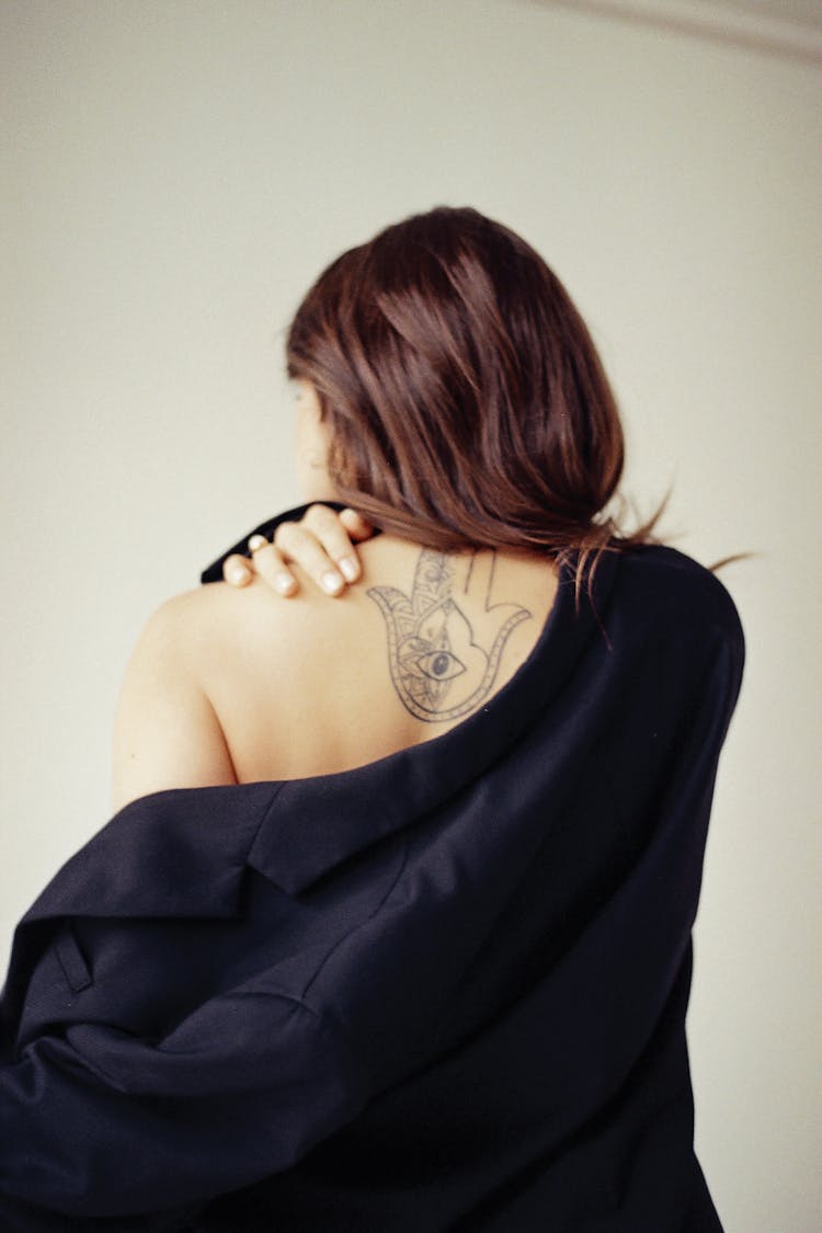 Woman With Tattoo On Her Back