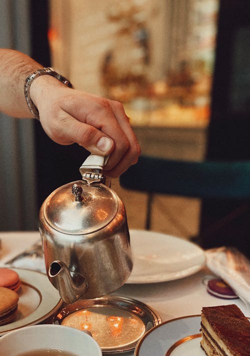 Free Person Pouring on Cup Stock Photo