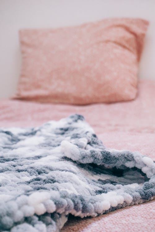 Free Pink Pillow and Gray and White Blanket on Bed Stock Photo