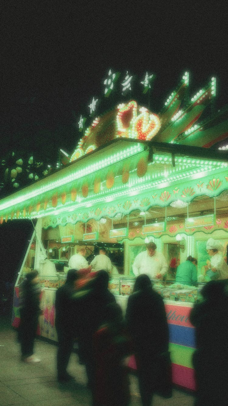 People Getting Food At A Carnival 