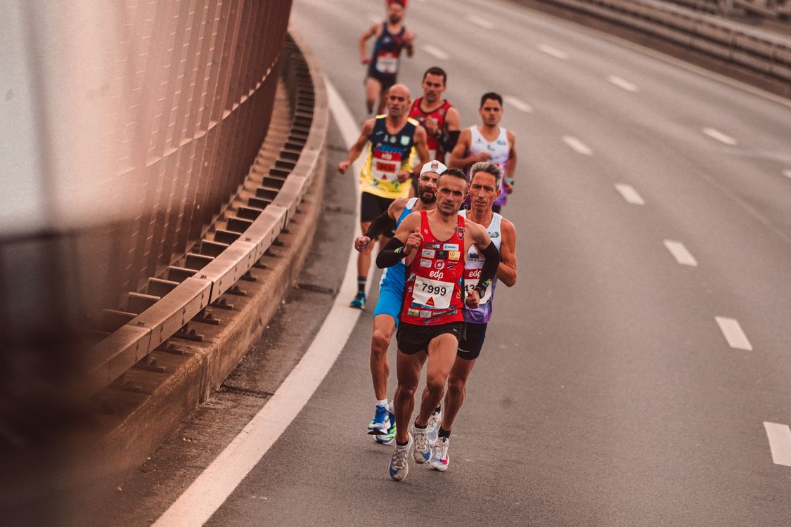 Men Running on the Side of the Road · Free Stock Photo