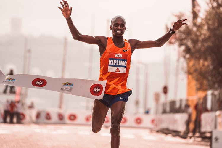 Man Crossing The Finish Line