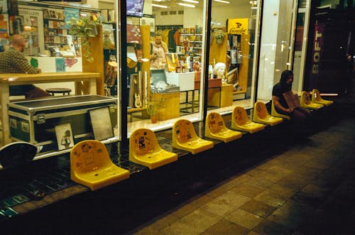 Free Chairs near Store Windows Stock Photo