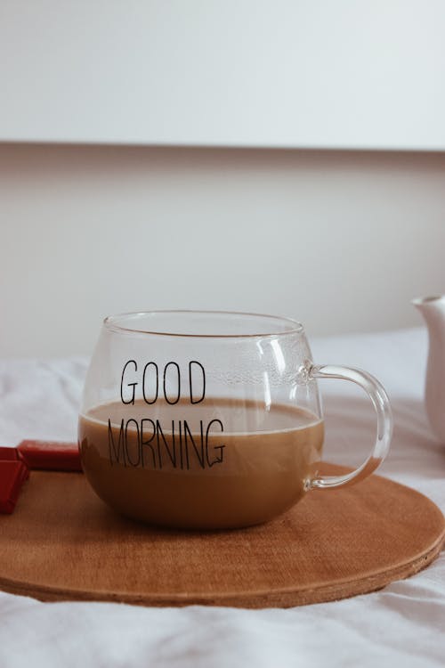 Close up on Coffee Glass on Tray on Bed