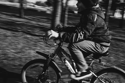 Free A Boy Riding a Bicycle Stock Photo
