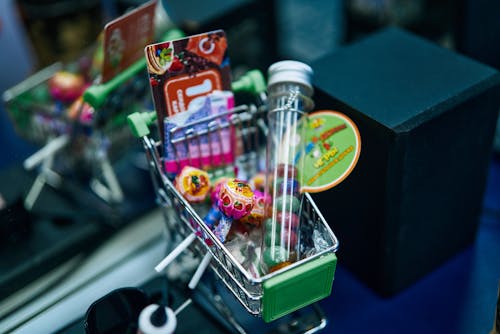 Free Candies on a Toy Push Cart Stock Photo
