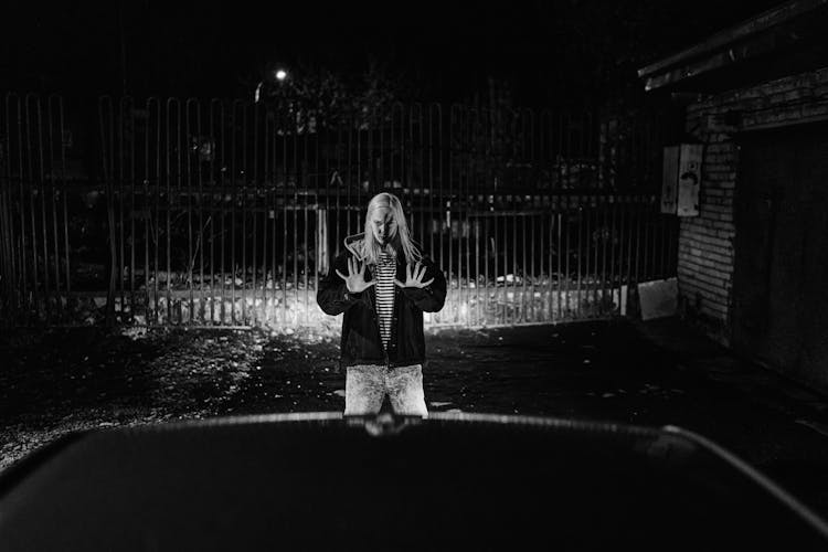 Blonde Woman Stopping Car Before Gate