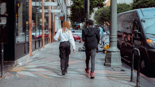 Back View of a Man and a Woman Walking Together