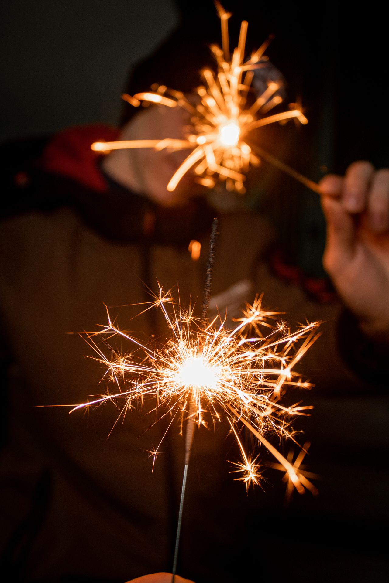 patriotic-gallery-3 Hands holding lit sparklers at night